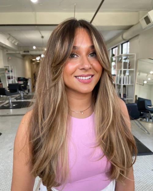 Модные стрижки на средние волнистые волосы с челкой: тренды 2019 года 27 Модные стрижки на средние волнистые волосы с челкой: тренды 2019 года 27